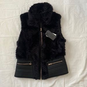 Ci Sono faux fur and leather vest! Great addition to your winter collection!